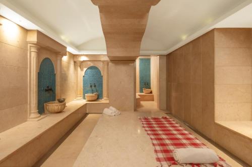 a room with a rug on the floor and two windows at Crowne Plaza Istanbul Asia by IHG in Istanbul