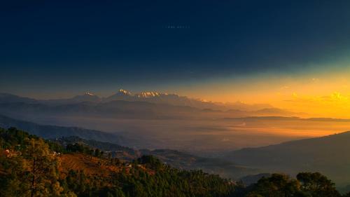 a view of a valley with mountains in the background at Himalaya Darshan Resort in Kausani