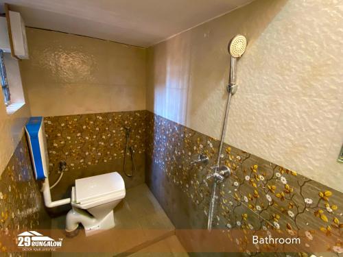 a bathroom with a shower and a toilet in a room at 5BR Rajkarn Boutique Villa by 29Bungalow in Udaipur
