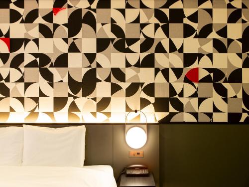 Säng eller sängar i ett rum på Mitsui Garden Hotel Shiodome Italia-gai - Tokyo