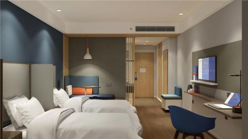 Postel nebo postele na pokoji v ubytování Holiday Inn Express Qiliping by IHG