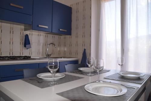 A kitchen or kitchenette at APPARTAMENTI Residence La Pergola
