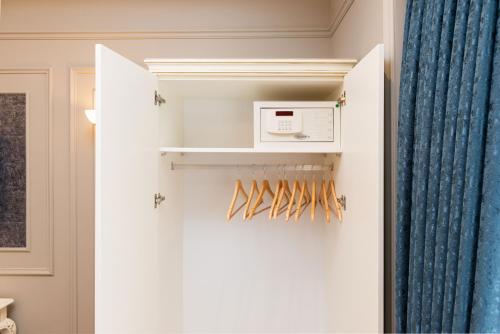 a white refrigerator with a microwave in a room at Begonville Mansion Oldcity in Istanbul