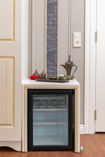 a small tv in a room next to a door at Begonville Mansion Oldcity in Istanbul