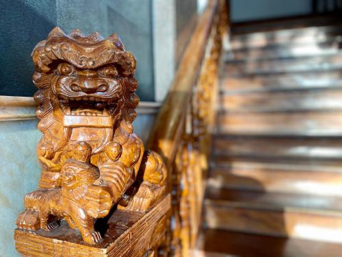 a golden lion statue sitting on top of a shelf at XO Hotels Infinity in Amsterdam
