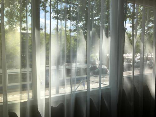 a window with a view of a street at XO Hotels Infinity in Amsterdam