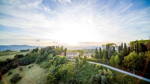 an aerial view of a house on a hill with trees at Agriturismo Il Sarale - Umbria in Città di Castello