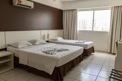 Cama ou camas em um quarto em Apartamento Le Jardin