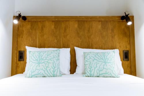 Ένα ή περισσότερα κρεβάτια σε δωμάτιο στο Anais Collection Hotels & Suites