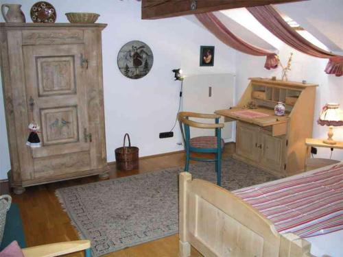 a room with a table and a desk and a table and a room with at Ferienwohnung Hemme in Bad Reichenhall