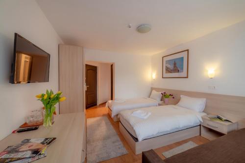 Ein Bett oder Betten in einem Zimmer der Unterkunft Pension Cluj