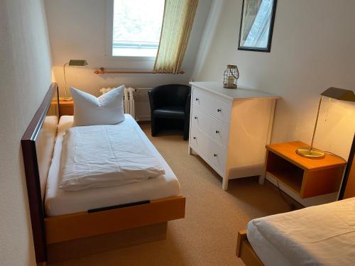 Giường trong phòng chung tại Ferienhaus Vier Jahreszeiten