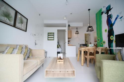 a living room with a couch and a table at La Bella Boutique Hotel in Tagaytay