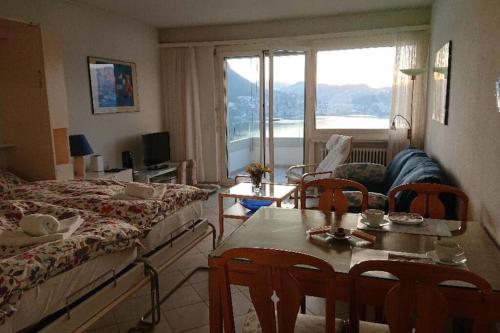 FLAT WITH AMAZING VIEW OVER THE GULF OF LUGANO photo 2