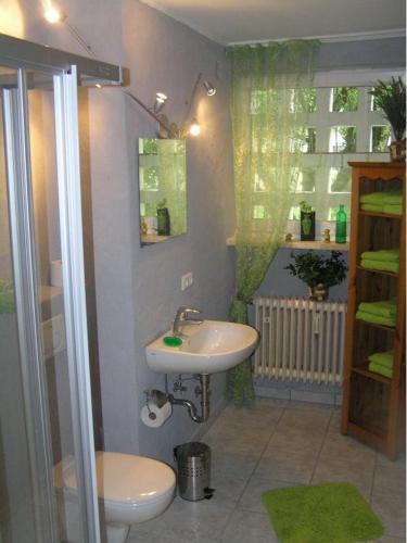 a bathroom with a sink and a toilet at Fewo Andrea in Bad Reichenhall