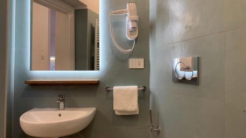 a bathroom with a sink and a mirror at Dimora del Leone Gaeta in Gaeta
