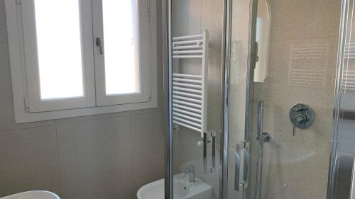 a bathroom with a shower with a sink and a toilet at Dimora del Leone Gaeta in Gaeta
