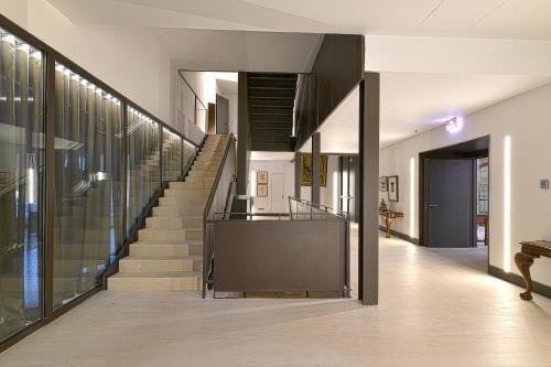 a hallway with a staircase in a building at Parador de Turismo de León in León