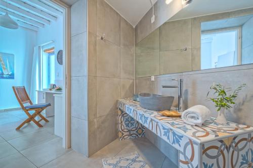 a bathroom with a counter with a sink on it at Veranta Luxury Suite in Khóra Sfakíon