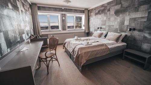 Un pat sau paturi într-o cameră la Danebu Kongsgaard - Boutique Hotel