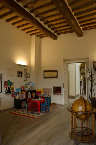 a living room with a table and chairs at Antico Sipario Boutique Hotel, BW Signature Collection in Paciano