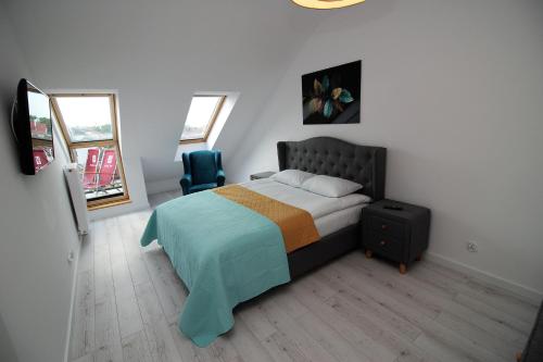 Кровать или кровати в номере Apartamenty Przy Latarni Kropla Bałtyku