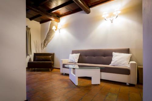a living room with a couch and a table at Villa Ca' Viola Rimini in Rimini