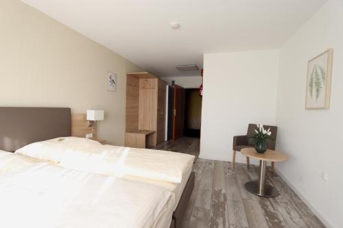 Ένα ή περισσότερα κρεβάτια σε δωμάτιο στο Kemnater Hof Apartments