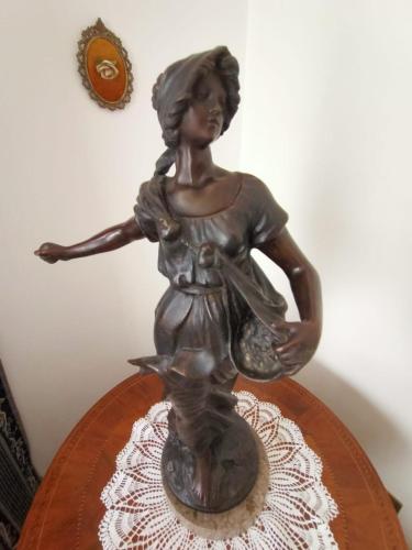 a statue of a woman on a table at Domus Cesena in Cesena
