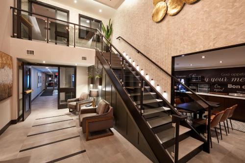 a large staircase leading up to a large room at Stay Inn Hotel Toronto in Toronto