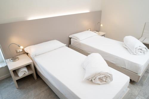 Voodi või voodid majutusasutuse Hotel Europa toas