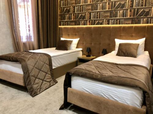 Кровать или кровати в номере Kuprin Hotel