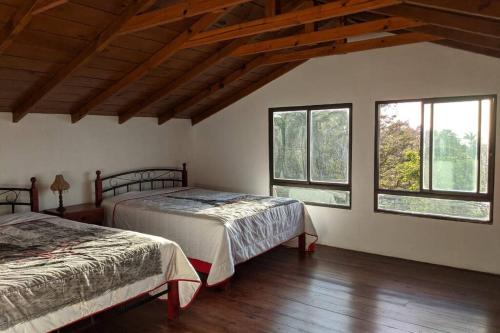 Postel nebo postele na pokoji v ubytování Casa de campo en las alturas