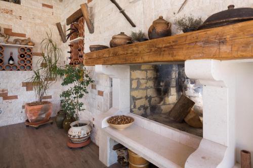 a room with a brick wall with a fireplace at Villa Mediterranean Paradise in Šibenik