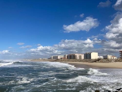 a view of a beach with buildings and the ocean at Terraços da Vagueira in Praia da Vagueira