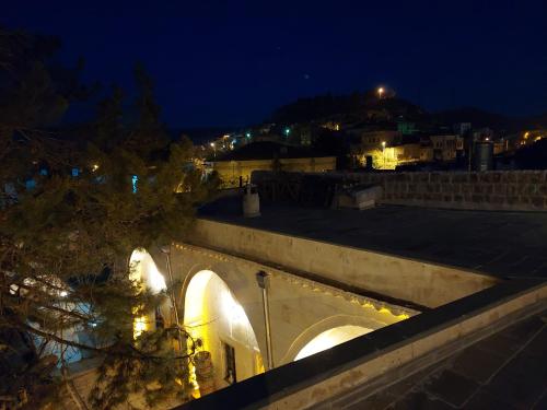 a view of a city at night at ARMEsos Cave Hotel in Urgup