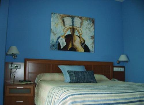 Cama o camas de una habitación en Hostal Quevedo