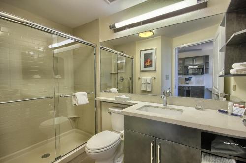 a bathroom with a toilet and a sink and a shower at Candlewood Suites Columbus - Grove City, an IHG Hotel in Grove City
