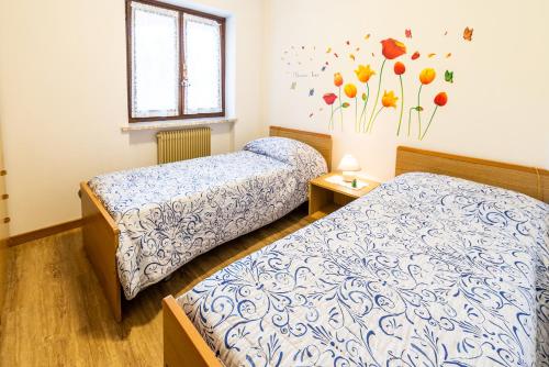 Postel nebo postele na pokoji v ubytování Casa Elisa Apartments