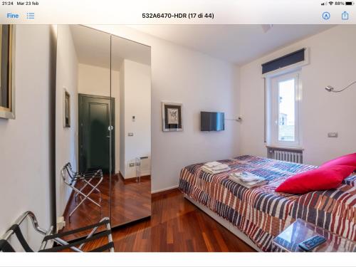 a bedroom with a bed and a mirror at Le Tre Torri in Parma