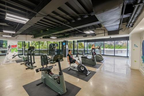 a gym with treadmills and elliptical machines at Grand Hotel Tijuana in Tijuana