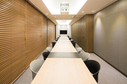 a long conference room with a long table and chairs at Orakai Cheonggyesan Hotel, BW Premier Collection in Seoul