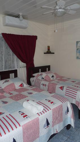 מיטה או מיטות בחדר ב-Hotel Arboleda