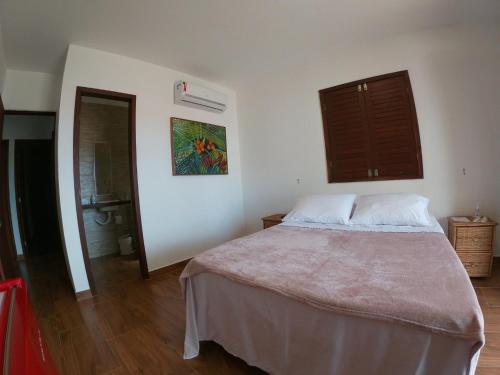 Кровать или кровати в номере Pousada Vila dos Santos