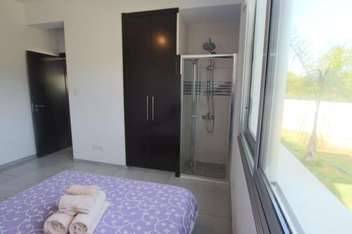 Postel nebo postele na pokoji v ubytování Akefalou Bay Villa