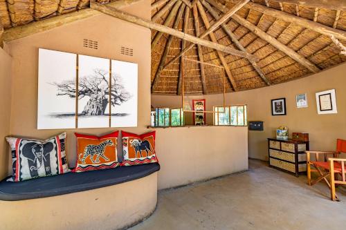 a room with several pillows on a wall at Umlani Bushcamp in Timbavati Game Reserve