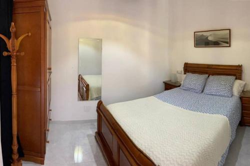 Postel nebo postele na pokoji v ubytování Casa antigua reformada junto al mar