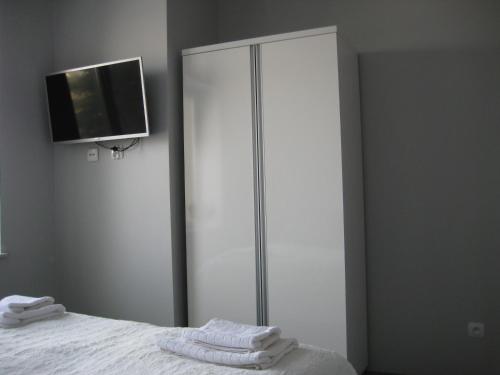 Postel nebo postele na pokoji v ubytování Apartamenty i pokoje Pluszak