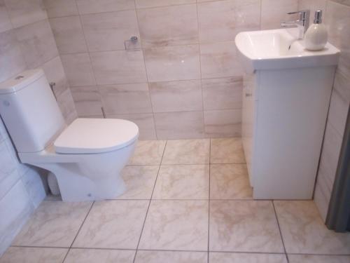 Koupelna v ubytování Apartamenty i pokoje Pluszak