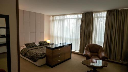 Posteľ alebo postele v izbe v ubytovaní Hotel Consul